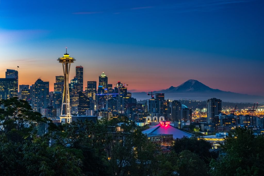 Seattle downtown skyline at nigh with the space needle lit up.