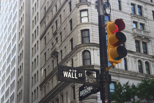 A picture of the Wall St and Broadway intersection in downtown NYC