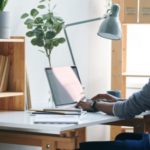 Employee working on a laptop at a desk